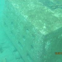 The same mooring after Chris and Lee Ann have scraped it clean. They did this in order to study the rate of new growth on the mooring, as compared to a nearby granite block of comparable size.